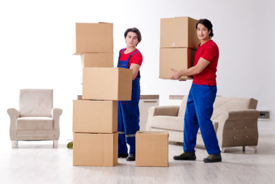 The two young movers moving personal belongings